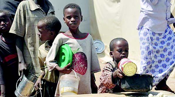 Children line up for food (courtesy National Mirror)